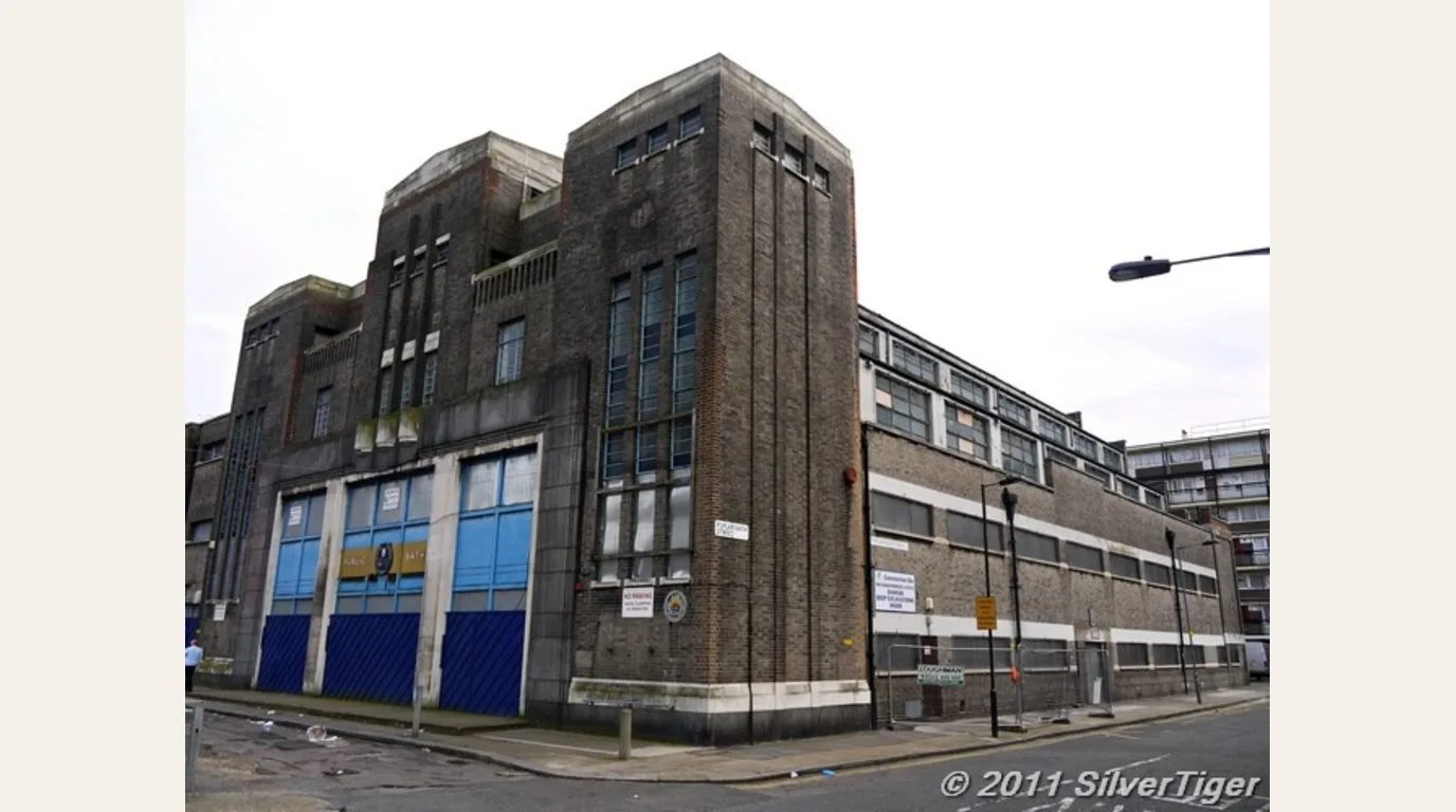 Poplar Public Baths in Poplar shown closed and derelict in a 2011 street photograph before restoration concept visualisation