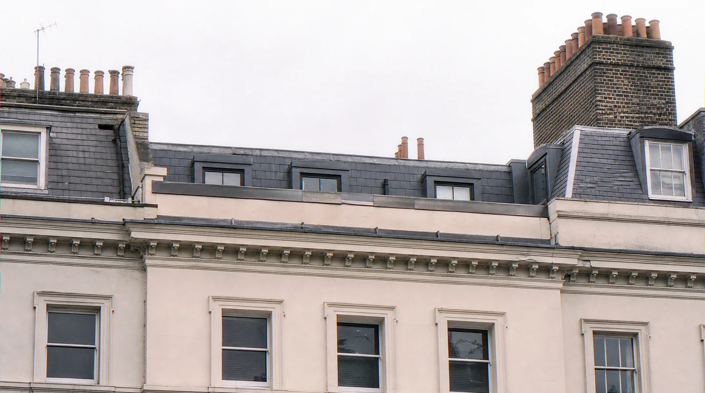 Close-up rendering of a Mayfair mansard and parapet detail at AVR Level 3 material fidelity